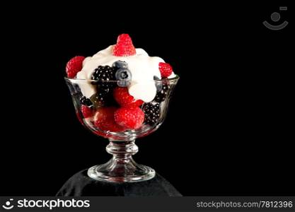 Healthy dessert of mixed berries topped with organic greek vanilla yogurt.