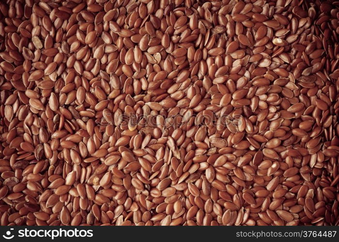 Healthy diet organic nutrition. Brown raw flax seeds linseed as natural food background