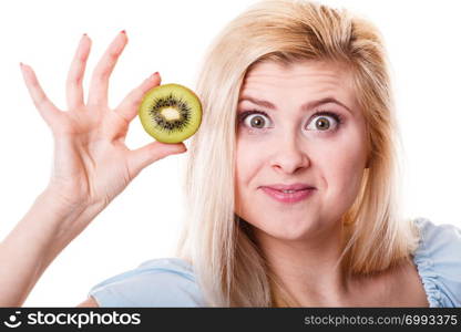 Healthy diet, refreshing food full of vitamins. Woman holding sweet delicious green kiwi fruit.. Woman holding green kiwi fruit