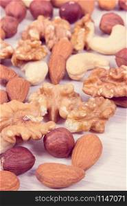 Healthy different nuts and almonds as source natural vitamins and minerals, nutritious eating concept. Different nuts and almonds as source vitamins and minerals
