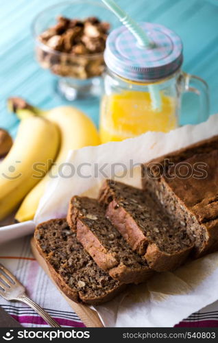 Healthy eating. Banana bread, bananas and orange juice on the table