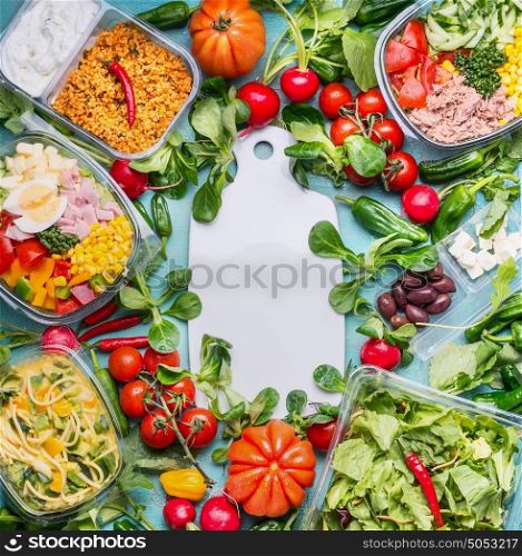 Healthy eating concept with various diet salad lunch boxes and ingredients around white cutting board, top view, frame. Clean organic food concept