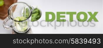 healthy eating, cooking, vegetarian food, detox and diet concept - close up of blender jar and green vegetables on table at home