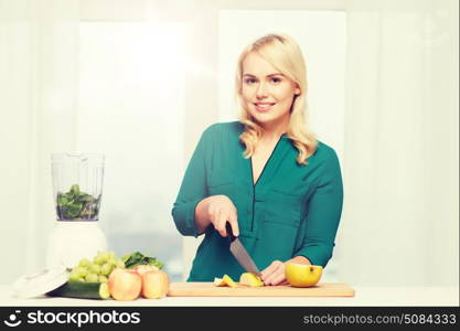 healthy eating, cooking, vegetarian food, diet and people concept - smiling young woman with blender and knife chopping fruits and vegetables on cutting board at home. smiling woman with blender cooking food at home. smiling woman with blender cooking food at home