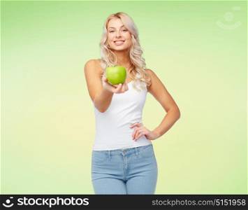 healthy eating, diet and people concept - happy beautiful young woman with apple over green background. happy beautiful young woman with green apple