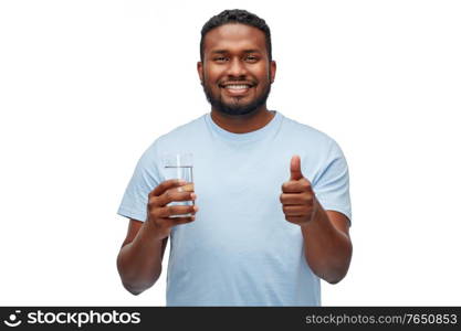 healthy eating, diet and people concept - happy smiling african american man with glass of water over white background. happy african american man with glass of water