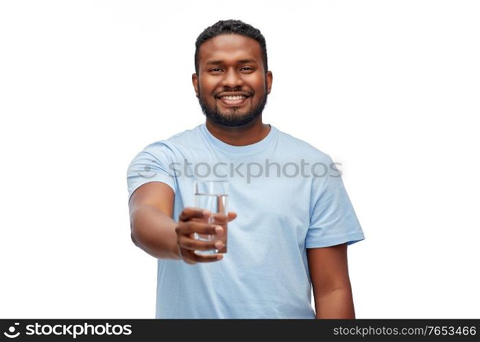 healthy eating, diet and people concept - happy smiling african american man with glass of water over white background. happy african american man with glass of water