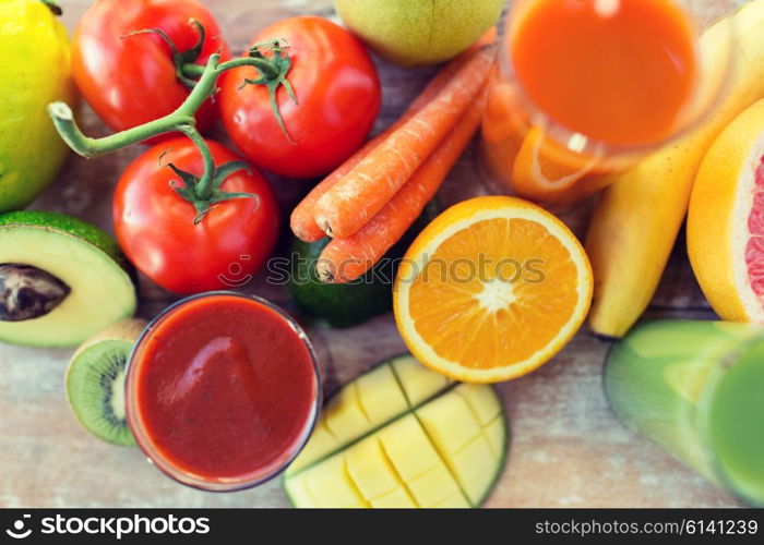 healthy eating, food and diet concept - close up of fresh juice glass and fruits on table