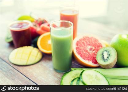 healthy eating, food and diet concept- close up of fresh juice glass and fruits on table