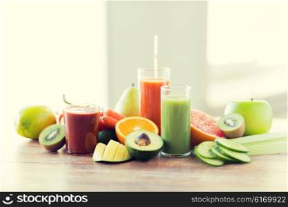 healthy eating, food and diet concept- close up of fresh juice glass and fruits on table