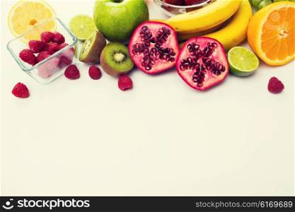 healthy eating, food and diet concept- close up of fresh ripe fruits and berries on table