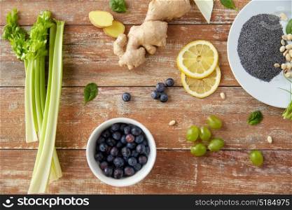 healthy eating, food and diet concept - fruits, berries and vegetables on wooden table. fruits, berries and vegetables on wooden table