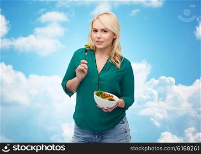 healthy eating, food, diet and people concept - smiling young woman eating vegetable salad with over blue sky and clouds background