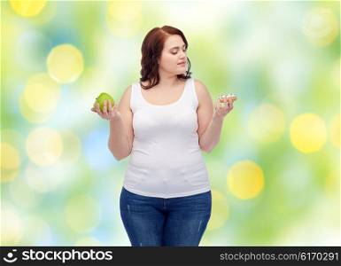 healthy eating, junk food, diet and choice people concept - plus size woman choosing between apple and cookie over green lights background