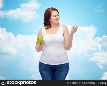 healthy eating, junk food, diet and choice people concept - smiling plus size woman choosing between apple and donut over blue sky and clouds background