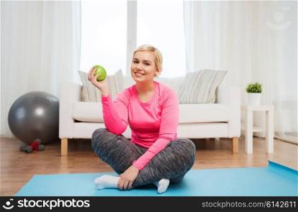 healthy eating, organic food, diet and people concept - happy woman eating green apple at home