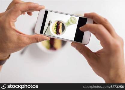 healthy eating, people and technology concept - hands photographing breakfast by smartphone. man photographing healthy breakfast by smartphone