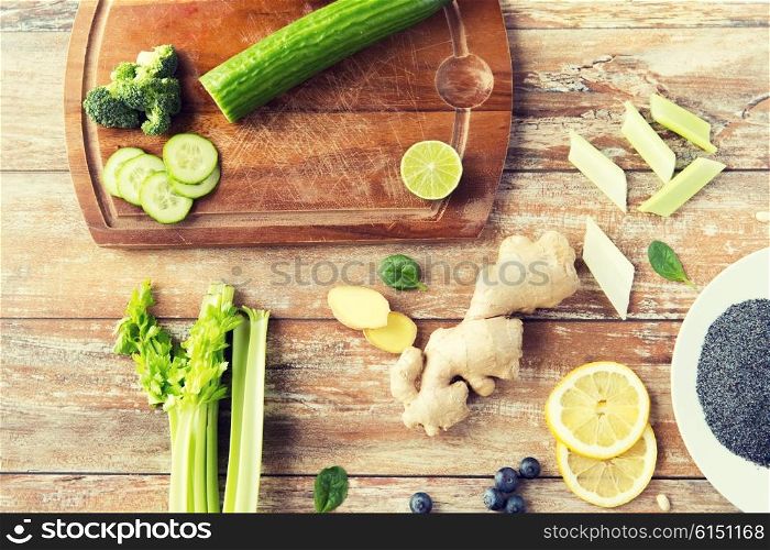healthy eating, vegetarian food, culinary and diet concept - close up of superfood ingredients on wooden table