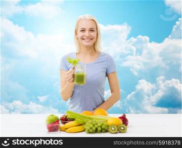 healthy eating, vegetarian food, diet, detox and people concept - smiling woman drinking green vegetable juice or shake from glass over blue sky and clouds background