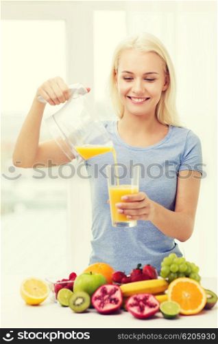 healthy eating, vegetarian food, diet, detox and people concept - smiling woman pouring fruit orange juice from jug to glass at home