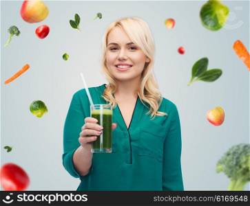 healthy eating, vegetarian food, diet, detox and people concept - smiling young woman drinking green vegetable juice or smoothie from glass over blue sky and clouds background