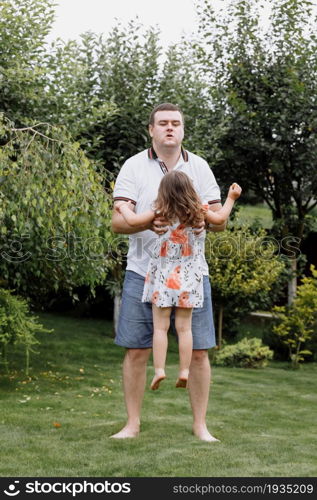 Healthy father and daughter playing together outdoors carefree happy fun smiling lifestyle. father&rsquo;s day.. Healthy father and daughter playing together outdoors carefree happy fun smiling lifestyle. father&rsquo;s day