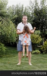 Healthy father and daughter playing together outdoors carefree happy fun smiling lifestyle. father&rsquo;s day.. Healthy father and daughter playing together outdoors carefree happy fun smiling lifestyle. father&rsquo;s day