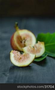 Healthy fig fruit. Portion of fresh Figs on wooden background
