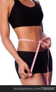 Healthy fit woman measuring waste, weightloss concept.