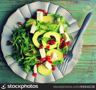 Healthy fitness salad with arugula, avocado, feta . Vegetarian nutritious salad. Keto diet. Keto lunch idea recipe.. Healthy fitness salad with arugula, avocado, feta . Vegetarian nutritious salad. Keto diet. Keto lunch idea recipe