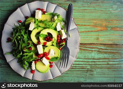 Healthy fitness salad with arugula, avocado, feta . Vegetarian nutritious salad. Keto diet. Keto lunch idea recipe.. Healthy fitness salad with arugula, avocado, feta . Vegetarian nutritious salad. Keto diet. Keto lunch idea recipe