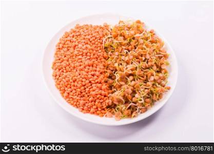 healthy food, a mixture of raw red lentils and sprouts on white