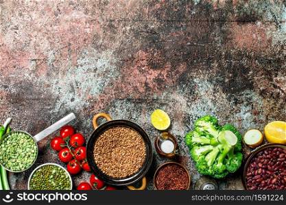 Healthy food. Assortment of Fruits and vegetables with legumes. On a rustic background.. Healthy food. Assortment of Fruits and vegetables with legumes.