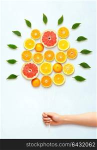 Healthy food concept and creative still life of bouquet made of fresh citrus fruits.
