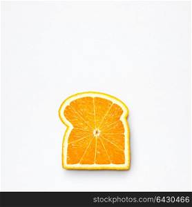 Healthy food concept and creative still life of bread slice made of fresh orange fruit.
