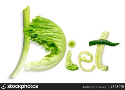 Healthy food concept and creative still life of diet word made of fresh green vegetables and fruits.