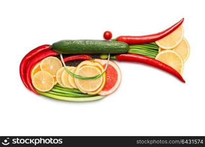Healthy food concept of a musical wind instrument clarion, trumpet or horn, made of vegetable mix, isolated on white.