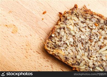 Healthy food, fit diet products concept. Whole grain bread with many big grains. Whole grain bread with many big grains