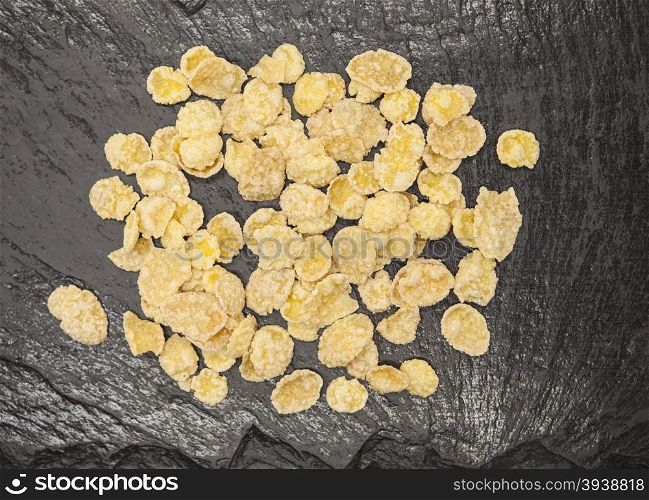 Healthy food: flakes honey on a stone background.. Healthy food: flakes honey on a stone background