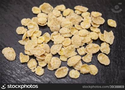 Healthy food: flakes honey on a stone background.. Healthy food: flakes honey on a stone background