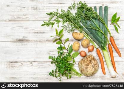 Healthy food. Fresh organic vegetables. Leek, carrots, onion, parsley, potatoes, celery root, bay laurel leaves