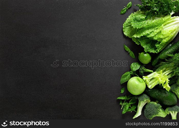 Healthy food, fresh raw green organic fruits and leafy vegetables, clean eating, vegetarian food concept background, top view