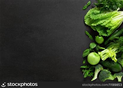 Healthy food, fresh raw green organic fruits and leafy vegetables, clean eating, vegetarian food concept background, top view