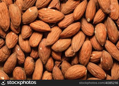 Healthy food, good for heart health. Almonds as background.