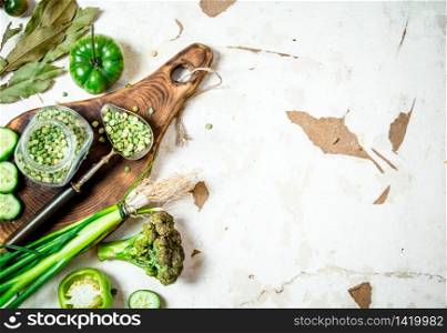 Healthy food. Green vegetables and herbs. On rustic background .. Healthy food. Green vegetables and herbs.