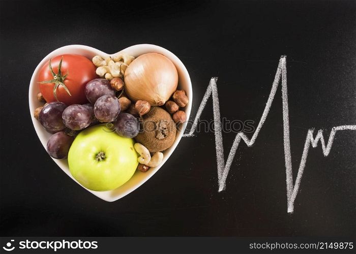 healthy food heart shape container with chalk drawn heart pulse blackboard