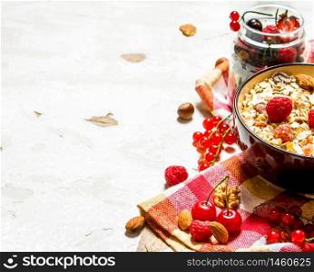 Healthy food. Muesli with forest wild berries. On rustic background.. Healthy food. Muesli with forest wild berries.