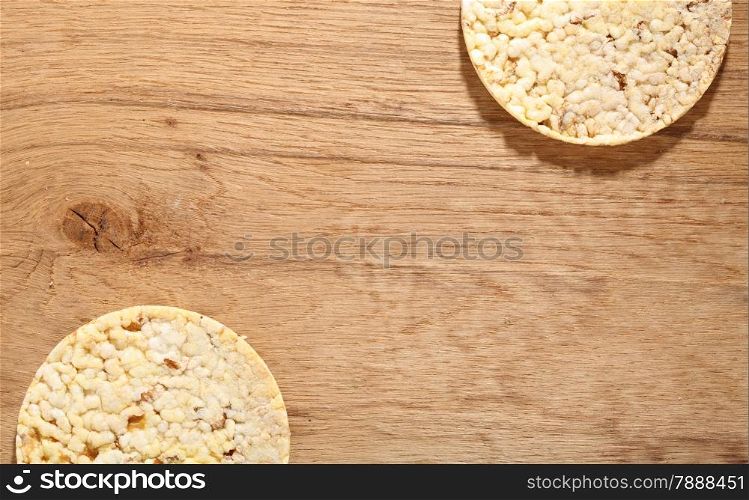 Healthy food nutrition. Thin round corn cakes on wooden background
