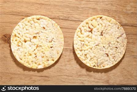 Healthy food nutrition. Thin round corn cakes on wooden background