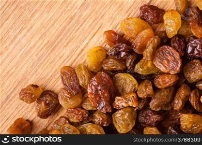 Healthy food organic nutrition. Border frame of raisin on wooden table background